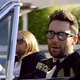 Adam Levine in the Sugar video, possibly wearing Transitions lenses